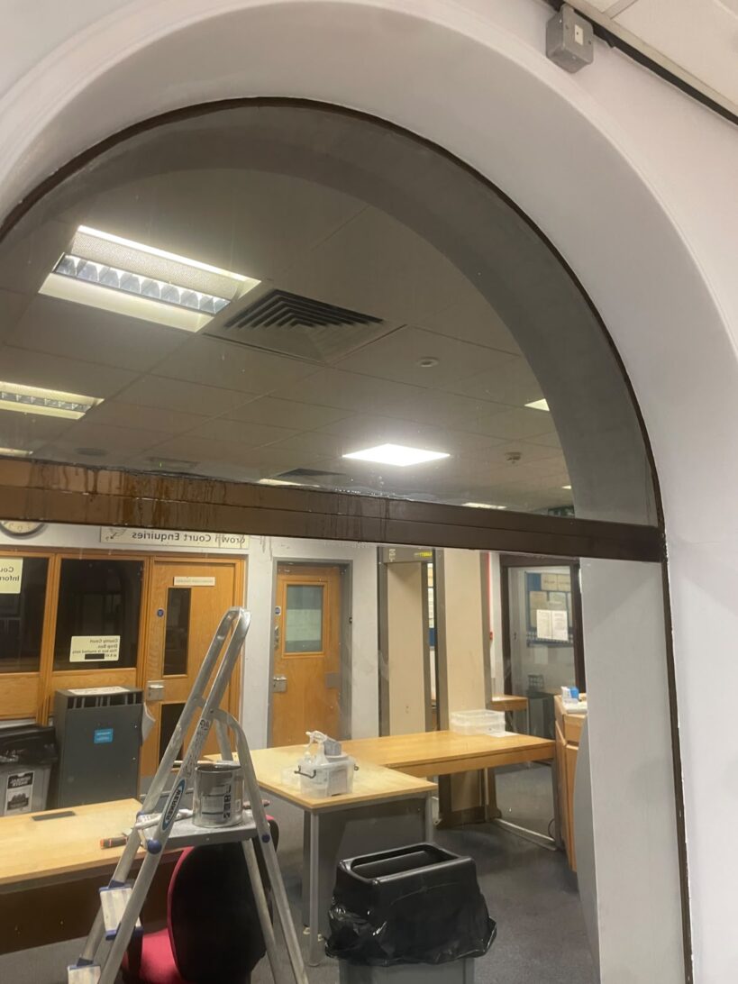 Arched reception window in a commercial building