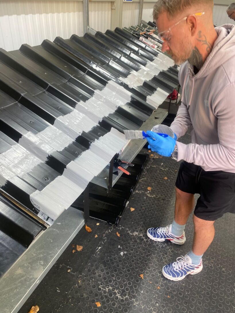 HD Sharman roof coating training, sheets being coated