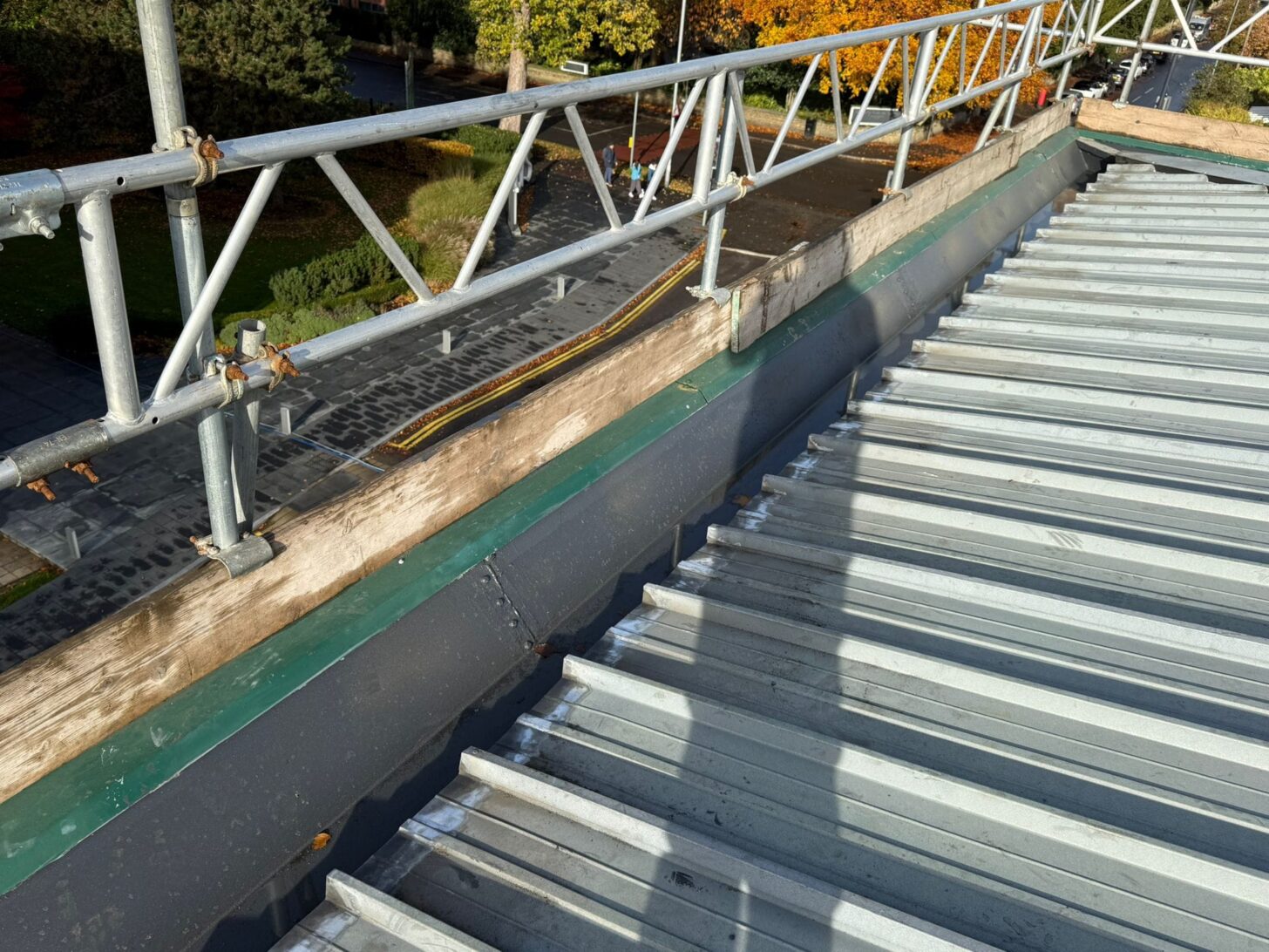 Commercial roof coating with edge protection